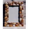 frame made pieces of shells polished by the sea 